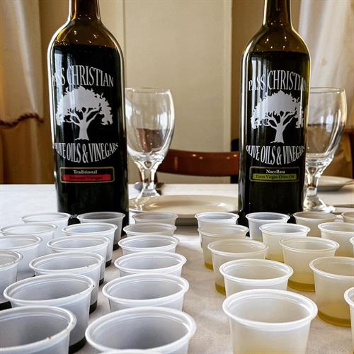 Pass Christian Olive Oils and Vinegars bottles being prepared for a tasting