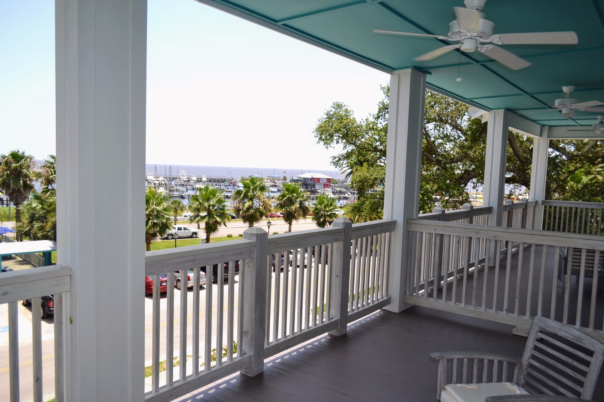Beach view balcony looking over the harbor for Hotel Pass Christian.